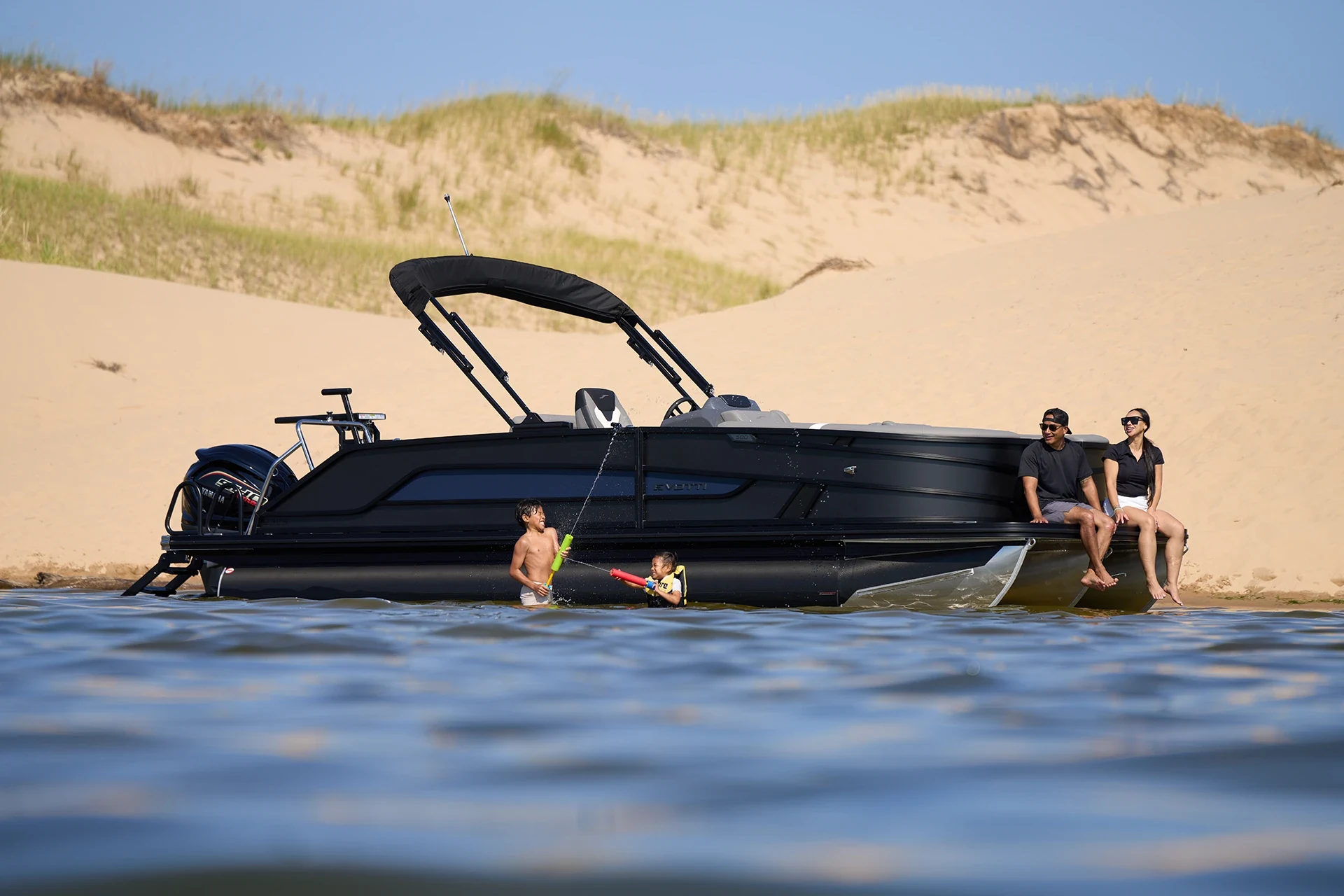 Evotti 500 Series 23CS beached with a group alongside