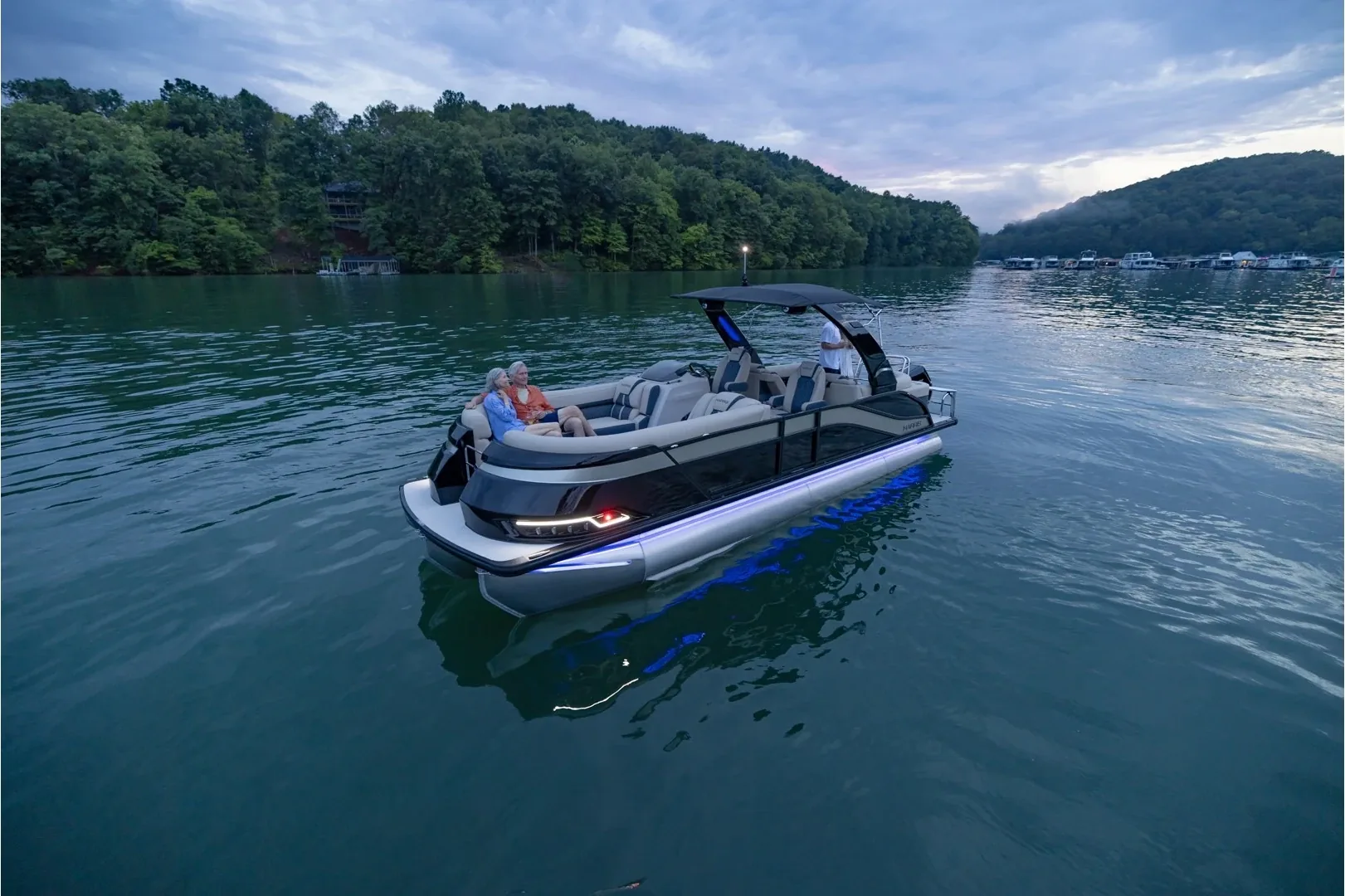 Grand Mariner 250 CWDH illuminated on a calm lake
