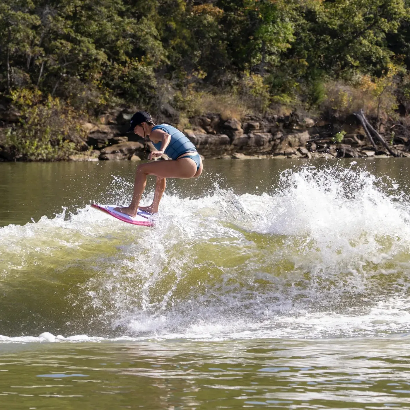 Doomswell wakesurf rider carving across the wake